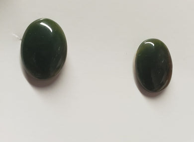 The pictures do this gorgeous set of Canadian Nephrite Jade cufflinks, absolutely no justice whatsoever. They are the deepest green, set with high quality 10K gold findings.