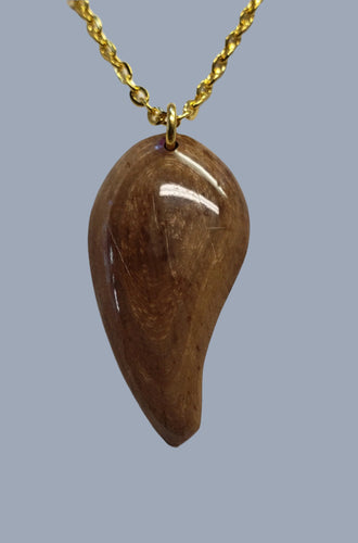 This necklace has been handcrafted from Alaskan Fossil Mammoth Ivory.  The Mammoth Ivory is about 30,000 years old and all naturally colored just the way it came out of the ground. 