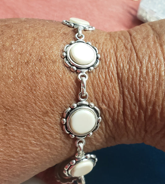 The ivory in this bracelet is Fossil Mammoth Ivory found in Alaska. It is currently at 9" in length but could be shortened to 7 or 8" in length.&nbsp;  Bracelet 150$  Earrings 45$ to match.