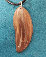 Load image into Gallery viewer, This 40,000 year old Necklace has been handcrafted from Alaskan Fossil Mammoth Ivory. It is 1.75&quot;×.50&quot; in size and hung on a 22&quot; black leather cord.
