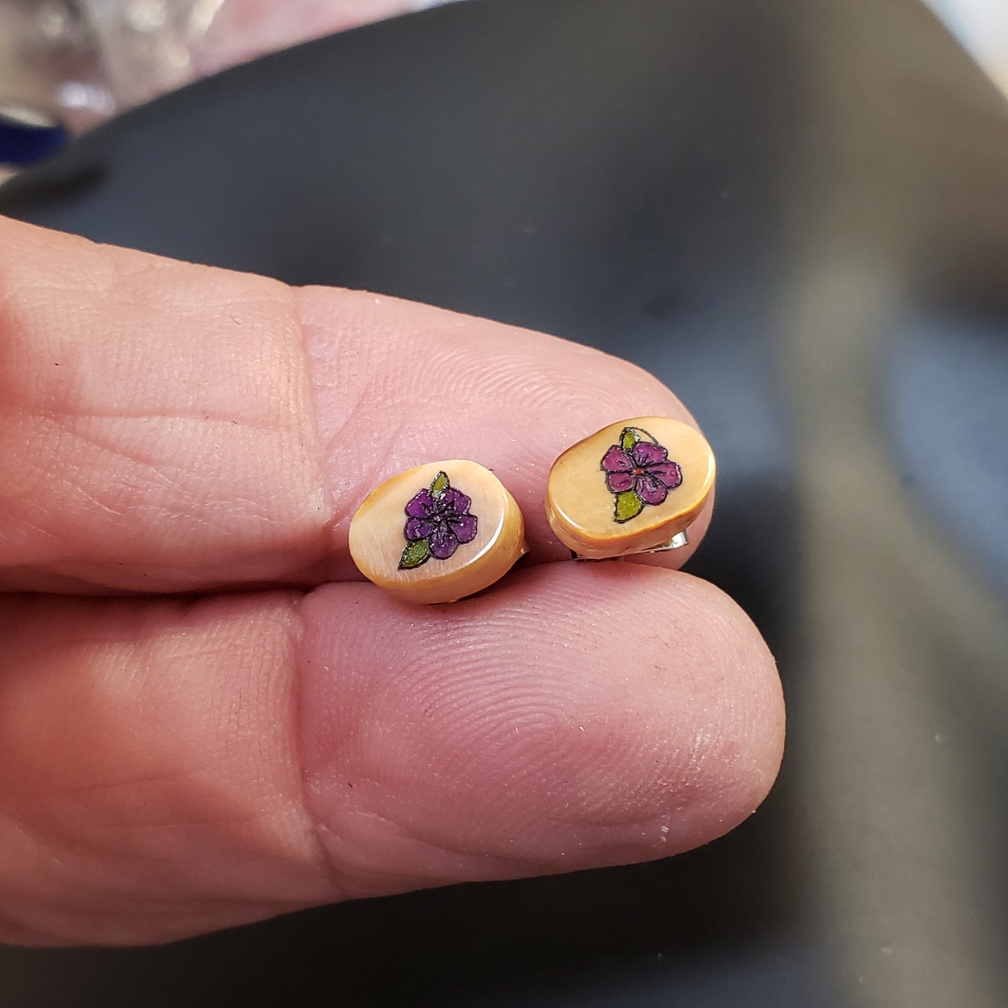 These tiny little Fossil Walrus Ivory Earrings have been hand Scrimshawed by an unknown artist from the middle of the last century. The craftsmanship in this pair has to be seen in person. Amazing work. .25"x.50" in size. Sterling silver posts.