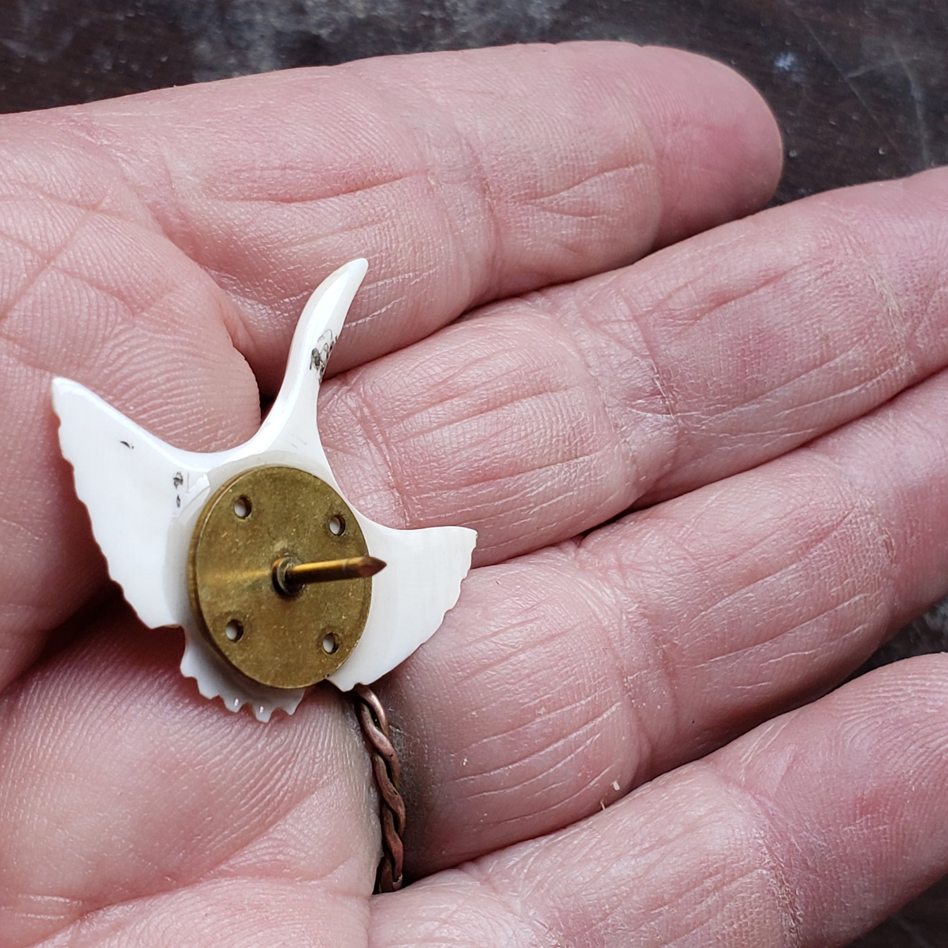 This gorgeous hand carved Tie Tack has been crafted from Fossil Walrus Ivory by an unknown Alaskan artist sometime in the 1950s or sixties. 